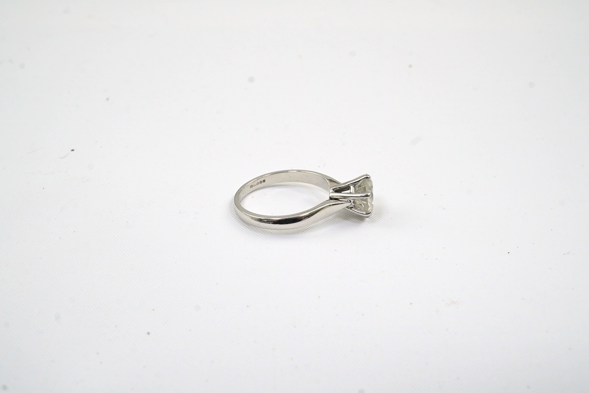 A modern 18ct white gold and solitaire diamond set ring